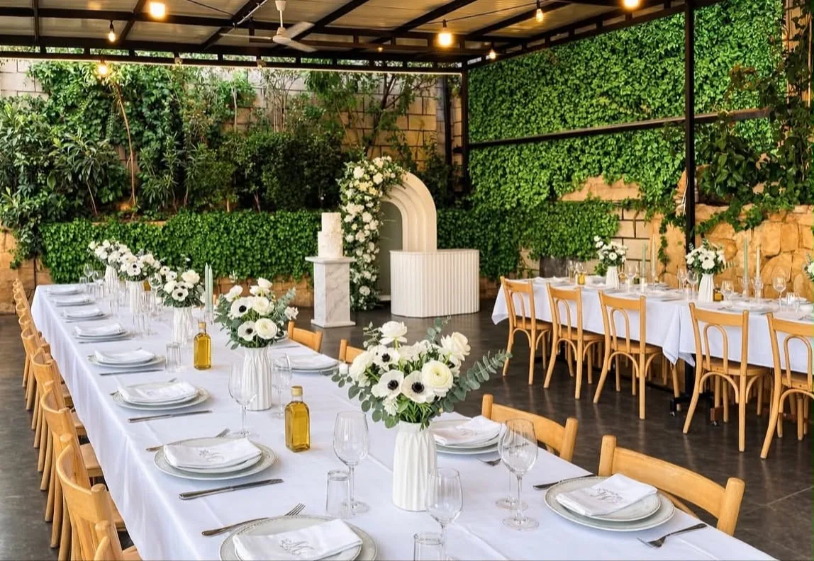 White floral private celebration dining arrangement at Khaymet Al Mazar