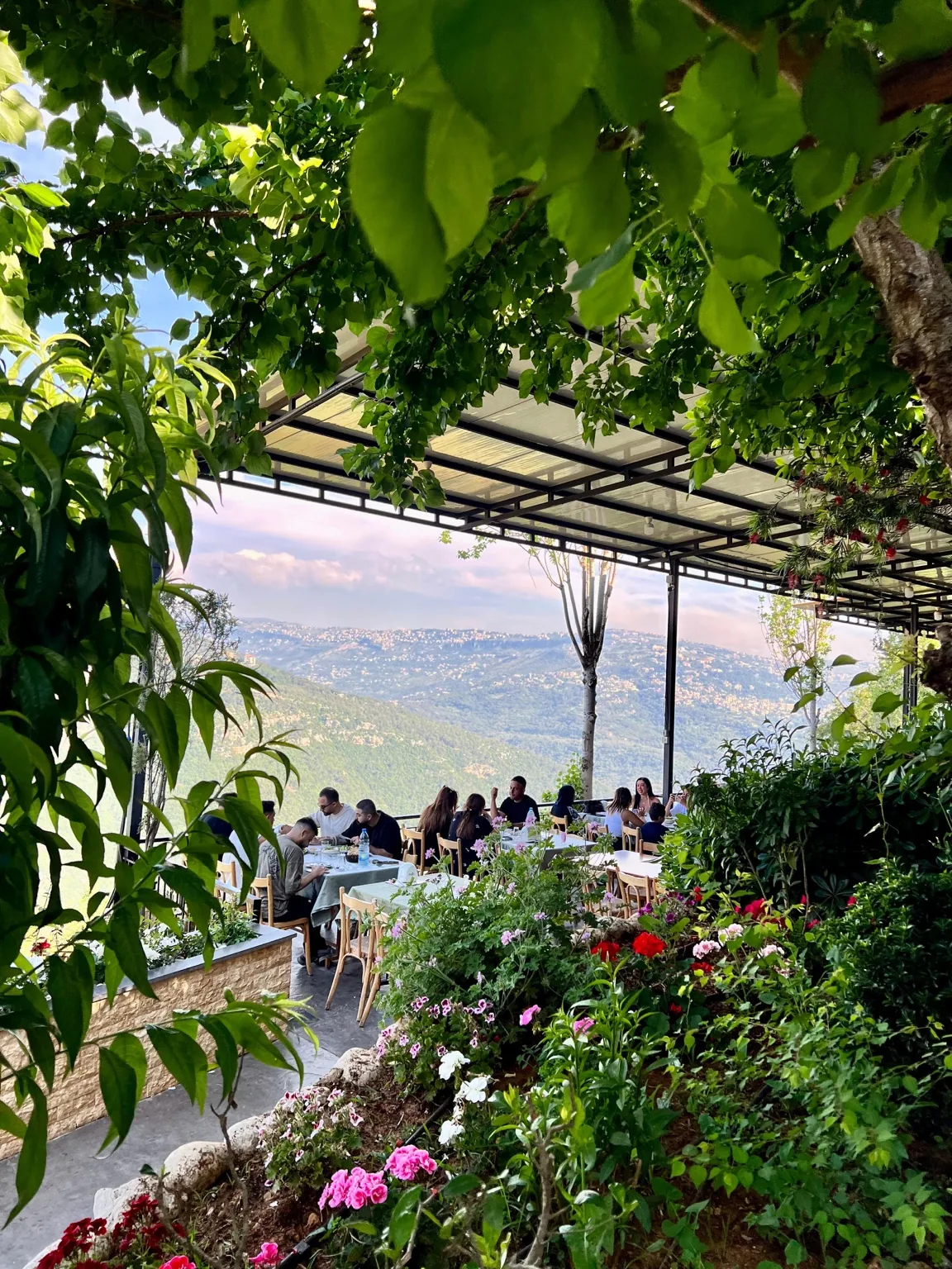 Garden-framed terrace overlooking green hills